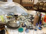 a table with a lot of dishes and bowls on it