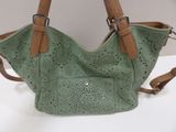 leather handbag with perforated design and leather strap