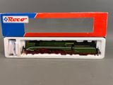 a close up of a toy train in a box on a table
