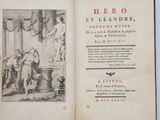 an open book with a picture of a man and a woman in a room