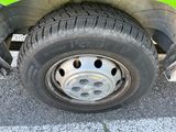a close up of a tire on a green vehicle