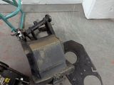 a machine that is sitting on the ground next to a wall