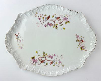 a white plate with a floral design on it