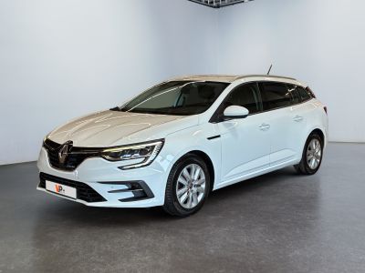 a white car is parked in a white room