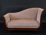 an image of a couch that is sitting on a black surface