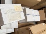 many boxes stacked on top of each other on the floor