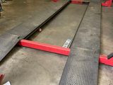 two ramps that are sitting on the floor in a garage