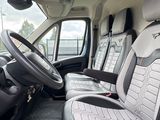 a view of the inside of a van with the driver ' s seat up