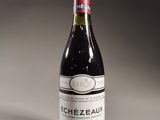 a bottle of wine that is sitting on a table