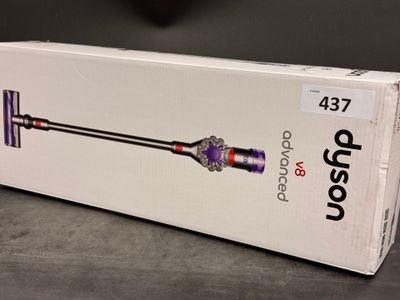 the box of the dysonon cordless vacuum is open on the table