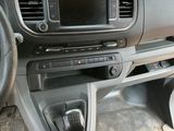 a dashboard of a car with a steering wheel and dashboard controls