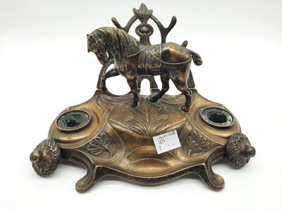 bronze figurine of a man riding a horse on a tortoise