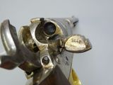 a close up of a gun that is on display