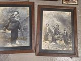 two framed pictures on the wall of a room