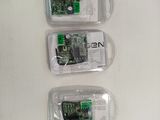 three cell phones that are in plastic bags on a table