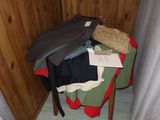 a pile of clothes sitting on top of a wooden table