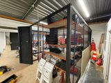 a room that has a lot of shelves and chairs in it