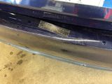 a close up of the bumper of a car with a sticker on it