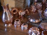 a table with a lot of silver items on it