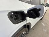 an electric car plugged into a charging station
