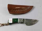 two different types of knives on a table