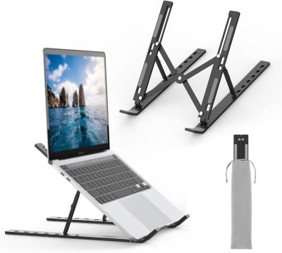 the laptop is sitting on a stand next to a pen and a pen holder
