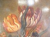 a painting of flowers in a vase on a table