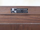 an image of a close up of a wooden table with a label on it