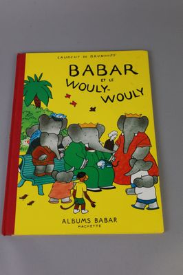 a yellow book with a picture of a group of elephants