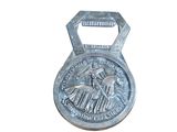 a metal bottle opener with a picture of a horse on it