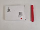 a red pen next to a white card on a table
