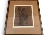 framed drawing of a woman holding a child in her arms