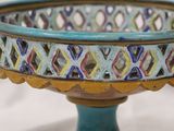 a close up of a decorative bowl on a table