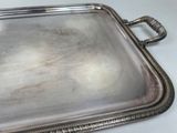silver plated serving tray with handles and handles on a table