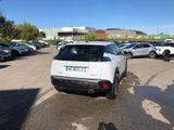 a white car that is parked in a parking lot