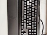 a computer keyboard and mouse sitting on a desk