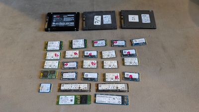 many different types of hard drives laid out on the floor