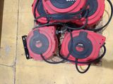 four red and black blowers sitting on the floor