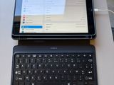 a laptop and a tablet on a table with a price tag
