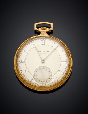 an old gold pocket watch with roman numerals and roman numerals on the face