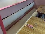 a long table with place settings on it in a restaurant