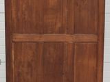 an image of a wooden cabinet in a room