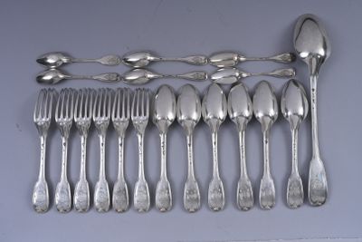 a lot of silver spoons and forks on the table