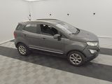 an image of a grey car parked in a garage