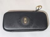 a black case that has a gold emblem on it