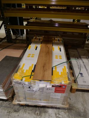 a pallet of wood sitting on a pallet in a warehouse