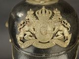 a helmet with a coat of arms and lions on it