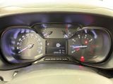 a close up of a car dashboard with a speedometer and gauges