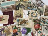 a pile of cards with flowers and pictures on them