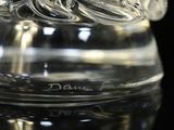 a clear glass vase with a wave design on it